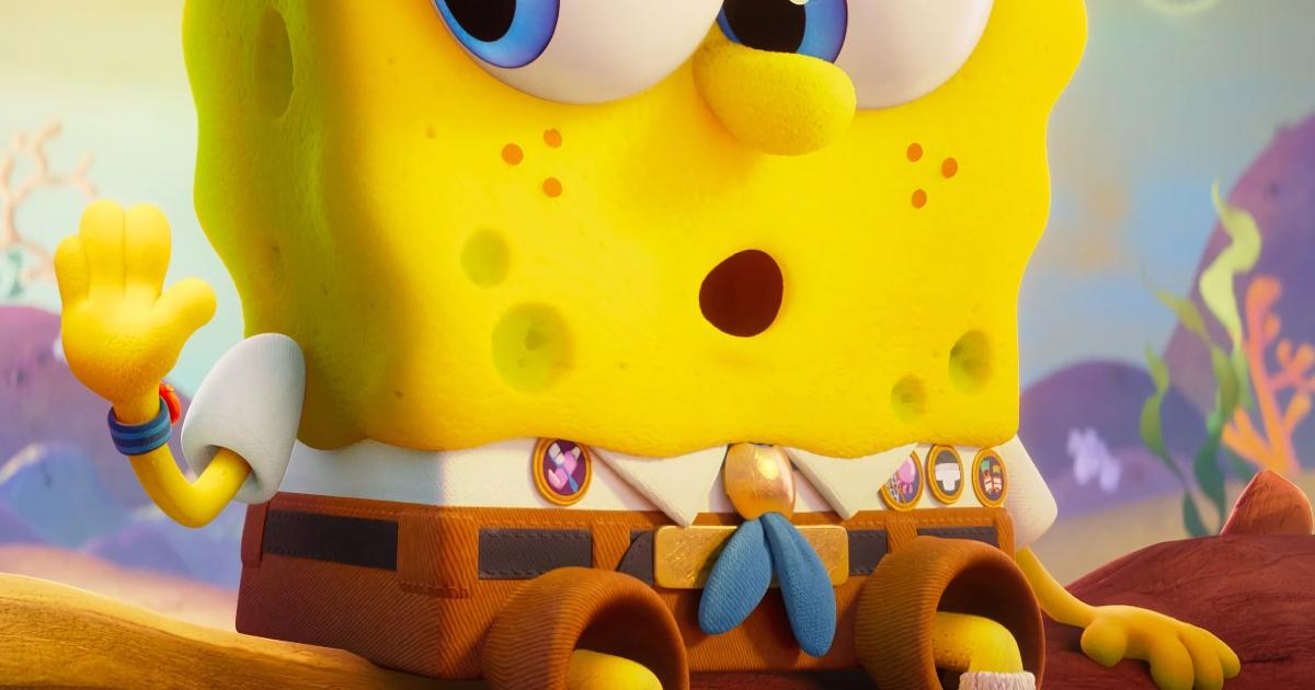 Bob Esponja, personaje animado amarillo con forma de esponja marina, aparece sorprendido y levantando una mano en un colorido escenario submarino, usado de forma simbólica para ilustrar el concepto de materiales que “piensan” y respiran del Nobel de Química 2025