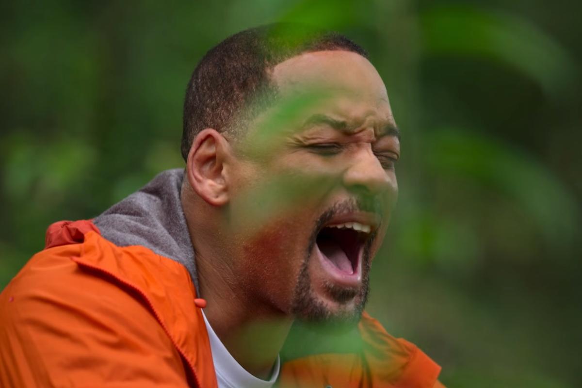 Will Smith grita con gesto de esfuerzo y emoción durante una expedición en plena selva, en una escena de su documental de Disney+ filmado en entornos extremos del planeta